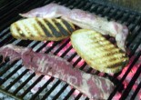 Rabbit and matambre flank steak grilling at Disbarat restaurant Barcelona food blog Claire Gledhill